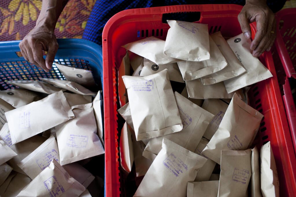 Peer educators and volunteers preparing safe injection kits at the Drop in center in Myitkyina, Kachin state.